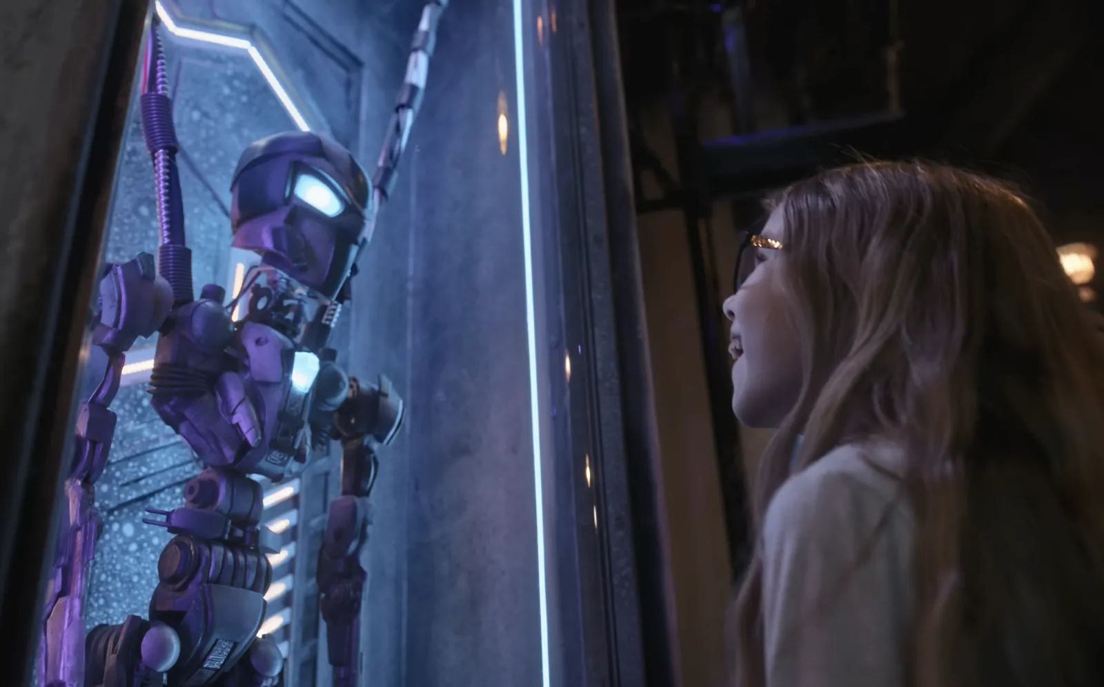 A kid looking at a holographic character